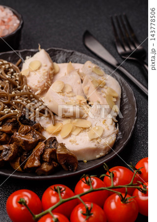 A bowl featuring slices of boiled chicken fillet, buckwheat noodles, and mushrooms A bowl featuring slices of boiled chicken fillet, buckwheat noodles, and mushrooms 143778506