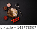 A bowl featuring slices of boiled chicken fillet, buckwheat noodles, and mushrooms 143778507