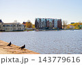Mercure hotel located in modern building with a patterned facade reflected in the calm river waters in Kaliningrad, Russia 143779616