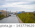 View along the Pregel River in Kaliningrad with famous building of the museum of the World Ocean designed in the shape of a giant sphere resembling the Earth and the cosmos 143779620