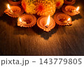 Diwali diyas and marigold flowers celebrating the festival of lights 143779805