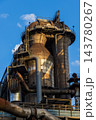Vertical photo of historic blast furnace cowper stove dome top upper catwalk balconies exhaust piping steel framework and blue sky in Duisburg Ruhr region North Rhine Westphalia Germany 143780267