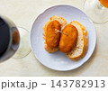 Hearty homemade food - crispy cutlets cooked in breadcrumbs, complemented with piece of bread. 143782913