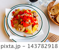 Potato salad with egg, canned tuna, onions, baked peppers and olives 143782918