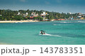 Tourist boat on turquoise sea near Unawatuna beach in Sri Lanka 143783351