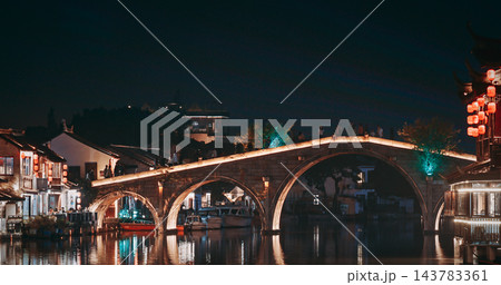 Serene Night View of a Modern Bridge with Reflections in Waterway. Zhujiajiao, Shanghai, China 143783361