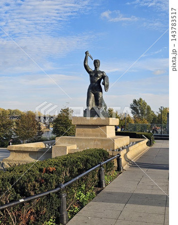 Warsaw, Poland - October 5, 2026: Warsaw Mermaid monument beside riverside steps 143783517