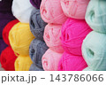 Stacks of yarn skeins in assorted colors at a craft supply shop 143786066