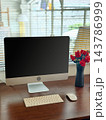 Minimalist Modern Desktop Computer Workspace with Black Screen Mockup and Red Roses 143786999