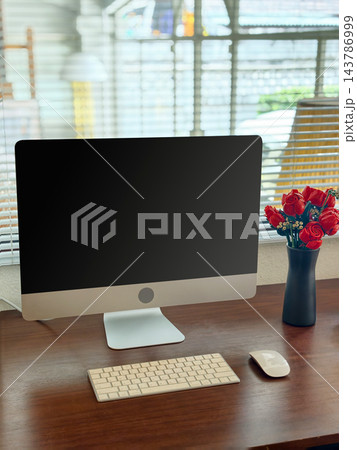 Minimalist Modern Desktop Computer Workspace with Black Screen Mockup and Red Roses Minimalist Modern Desktop Computer Workspace with Black Screen Mockup and Red Roses 143786999