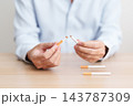 Man hand break cigarette for World No Tobacco Day concept, quitting smoking to prevent Lung Cancer, COPD, Emphysema and Tuberculosis disease. healthy lifestyle resolution, stop nicotine addiction 143787309
