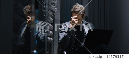 Frustrated Male Network Engineer Losing His Temper While Facing Critical Server Failure Frustrated Male Network Engineer Losing His Temper While Facing Critical Server Failure 143793174