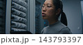 IT Technician Wearing Headset and Reviewing Network Connections on Tablet  143793397
