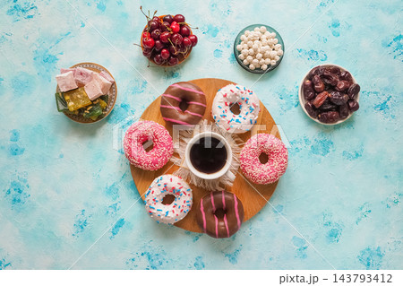 Sweet Coffee Break Flat Lay: Glazed Donuts, Cherries and Oriental Desserts 143793412
