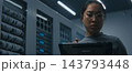 IT Engineer Examining High Density Network Ports, Cable Connections While Reviewing Data on Tablet 143793448