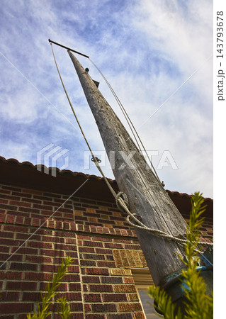 Low Angle Wooden Telephone Pole Brick Building and Sky in Washington Low Angle Wooden Telephone Pole Brick Building and Sky in Washington 143793678