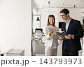 Happy Latin business leader woman showing online project 143793973