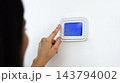 Close up of smart home thermostat control panel 143794002