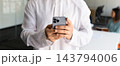 Banner Middle Eastern businessman in traditional kandura dress using smartphone 143794006