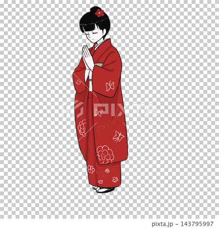 A woman in a furisode kimono clasps her hands together and prays at a shrine for the first time of the year. 143795997