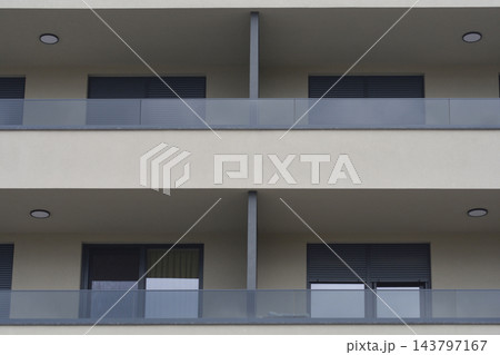 Building facade with glass balconies 143797167