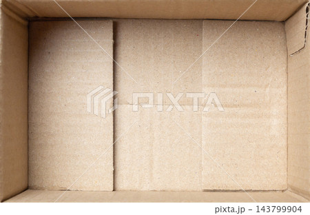 Open empty brown cardboard box background top view 143799904