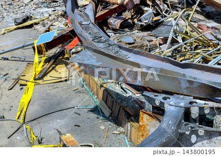 Prepare to clear debris, metal structures left after building was taken down in an urban area. Prepare to clear debris, metal structures left after building was taken down in an urban area. 143800195