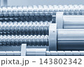 Close-up of a ball screw and bushing set in a CNC milling machine structure in a blue tone scene 143802342