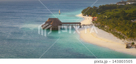 Aerial view of beautiful bungalow restaurant green ocean and sandy beach 143803505