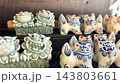 お土産屋さんに並ぶ、かわいいシーサーの置物 沖縄県	 143803661