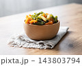 Dry tricolor fusilli pasta in bowl 143803794