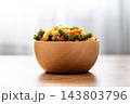 Dry tricolor fusilli pasta in bowl 143803796