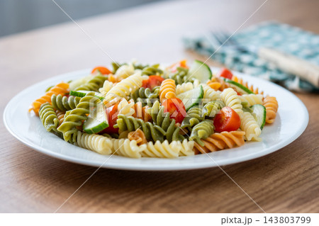Colorful fusilli pasta salad with fresh vegetables and feta cheese 143803799