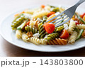 Colorful fusilli pasta salad with fresh vegetables and feta cheese 143803800