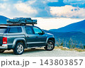 Off road vehicle with roof top tent camping in mountain 143803857