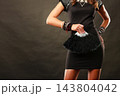 woman evening dress with black fan in hand 143804042