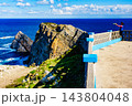 Tourist with camera on Asturias coast, Spain 143804048