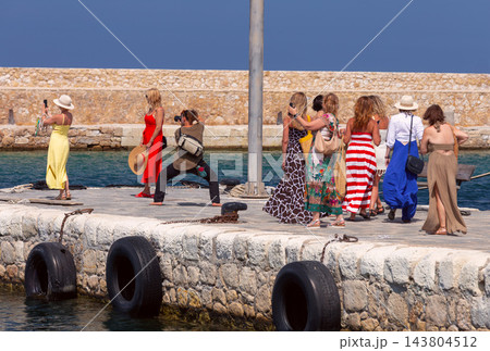 Tourists Taking Photos at the Venetian Harbor in Chania, Crete, Greece 143804512