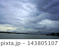 Vidyasagar Setu cable stayed bridge over Hooghly river under dark monsoon clouds in Kolkata 143805107
