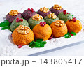 assortment of Pkhali, pumpkin, spinach and beetroot, Georgian dish, on a white plate, appetizer with nuts and spices, no people, homemade, 143805417