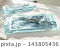 Sterile medical instruments, lying on a tray in protective packaging, dentist's instruments, preparation for a medical procedure. 143805436