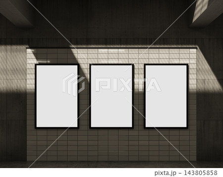 Blank three framed backlit posters on a white tile wall 3D render 143805858
