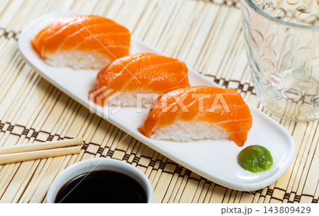 Sake Nigiri served in a plate with soya sauce Sake Nigiri served in a plate with soya sauce 143809429
