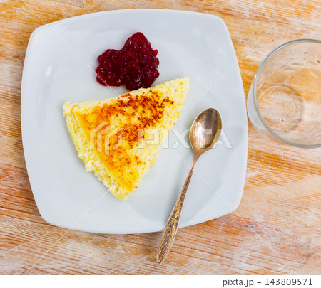 Cottage cheese casserole served with jam 143809571