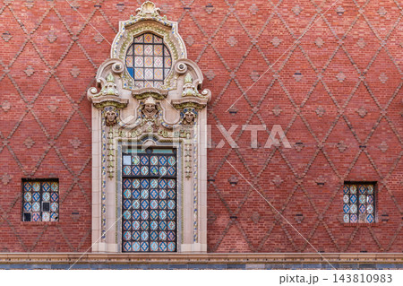Ornate Window Surround and Diamond Brickwork on a Red Brick Facade Ornate Window Surround and Diamond Brickwork on a Red Brick Facade 143810983