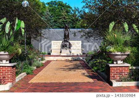 Winged Figure Monument at the End of a Landscaped Garden Path Winged Figure Monument at the End of a Landscaped Garden Path 143810984