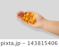 Omega 3. Person offers omega fish oil capsules in hand. Healthy lifestyle and nutrition concept. 143815406