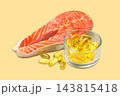Omega 3. Salmon fillet is placed next to softgel capsules of fish oil. 143815418