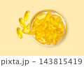 Omega 3. Capsules of omega fish oil are neatly arranged in a glass jar. 143815419