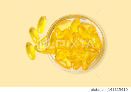 Omega 3. Capsules of omega fish oil are neatly arranged in a glass jar. 143815419